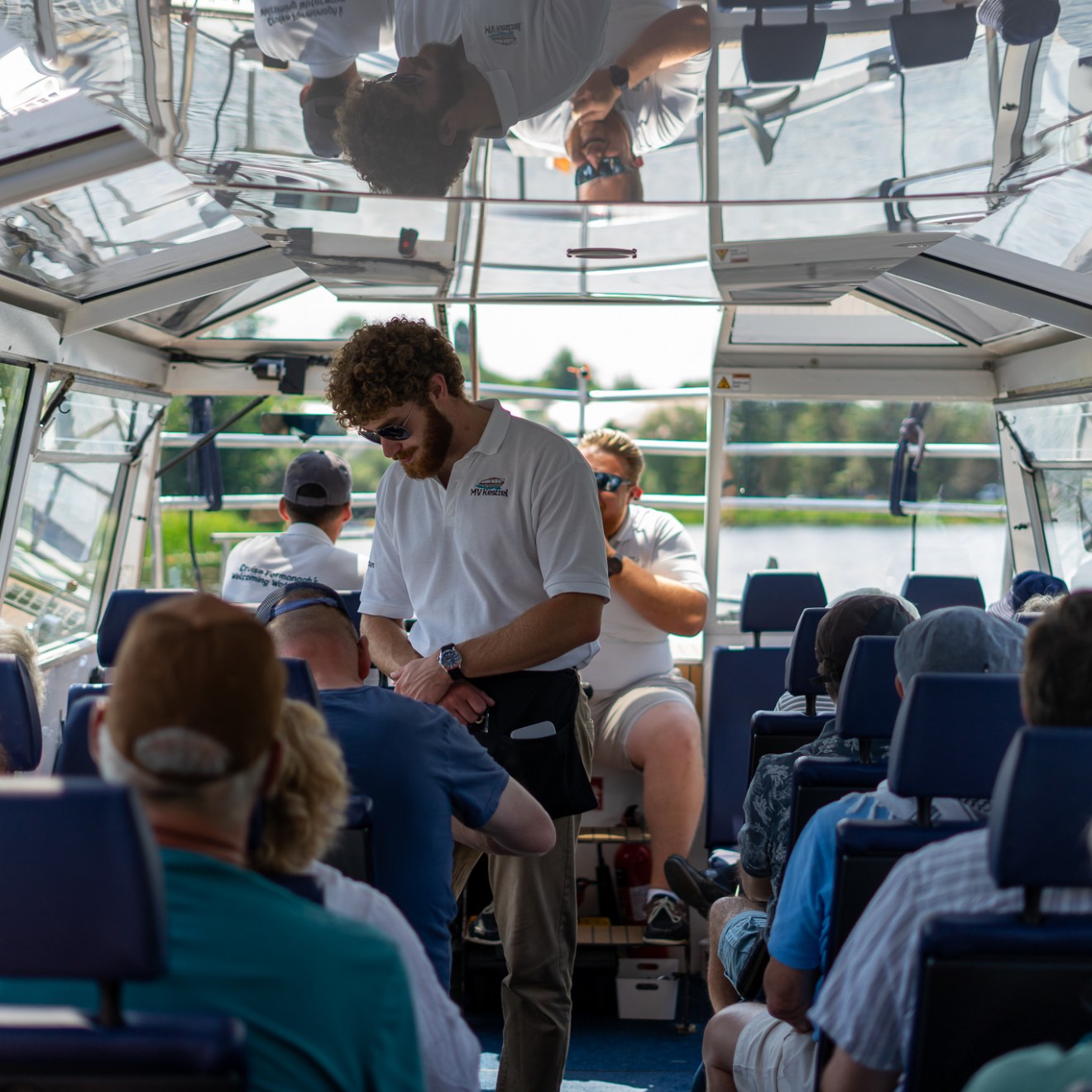 a group of people looking at a laptop
