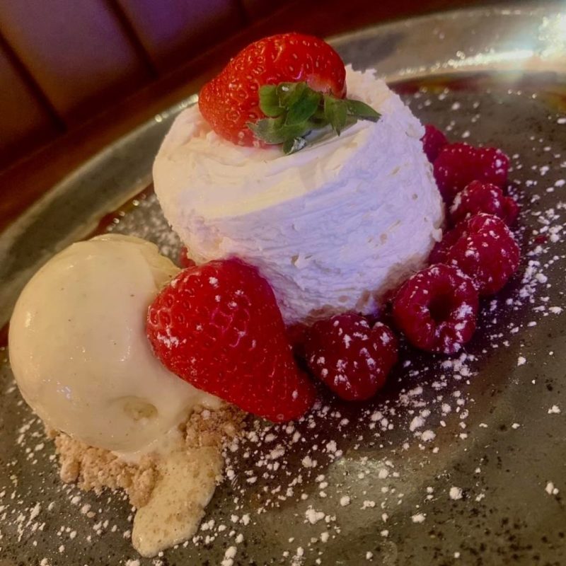 a piece of cake and ice cream on a plate