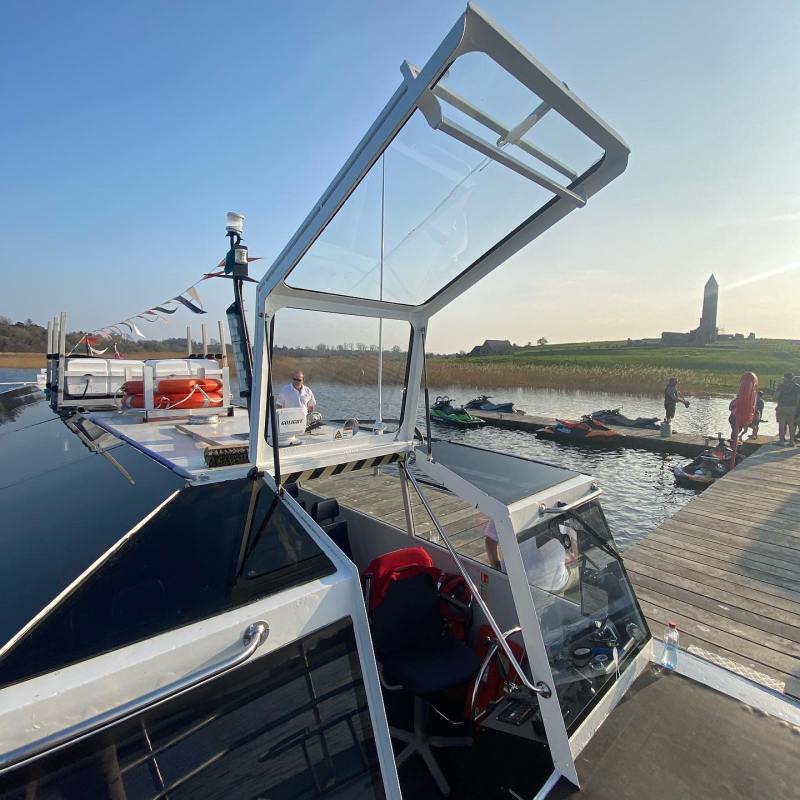 a boat is docked next to a body of water