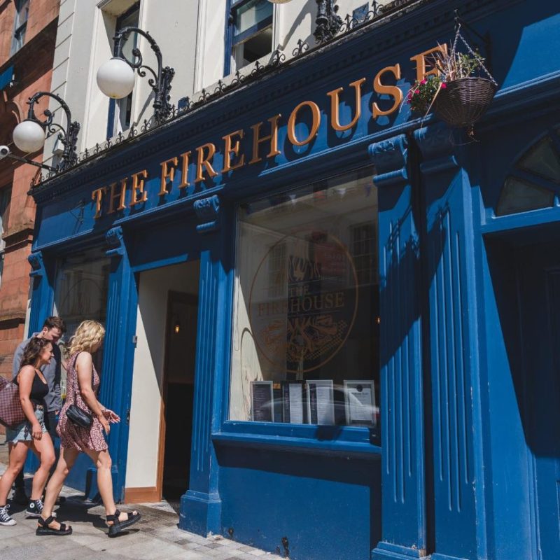 a person standing in front of a building