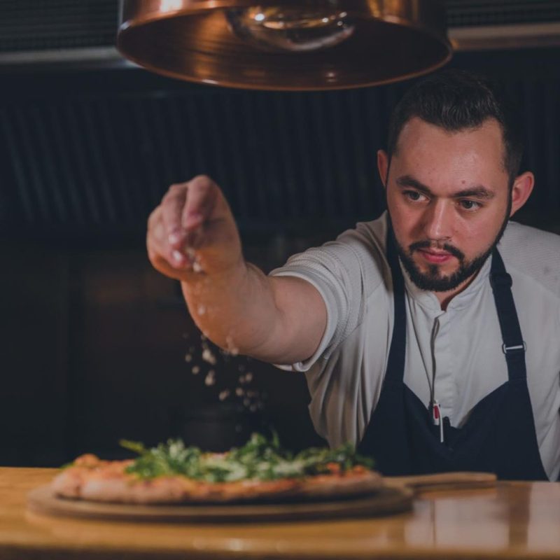 a man cutting a cake