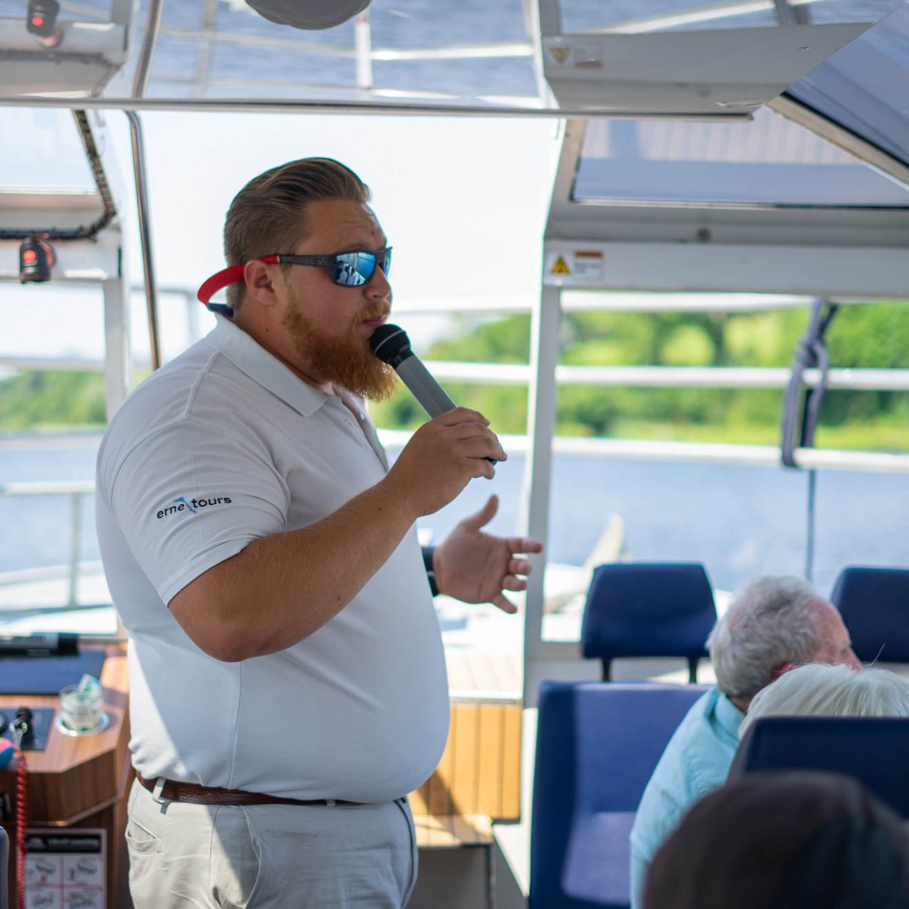 a group of people standing around a plane