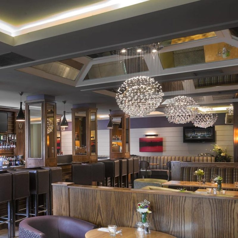 a room filled with furniture and vase on a table