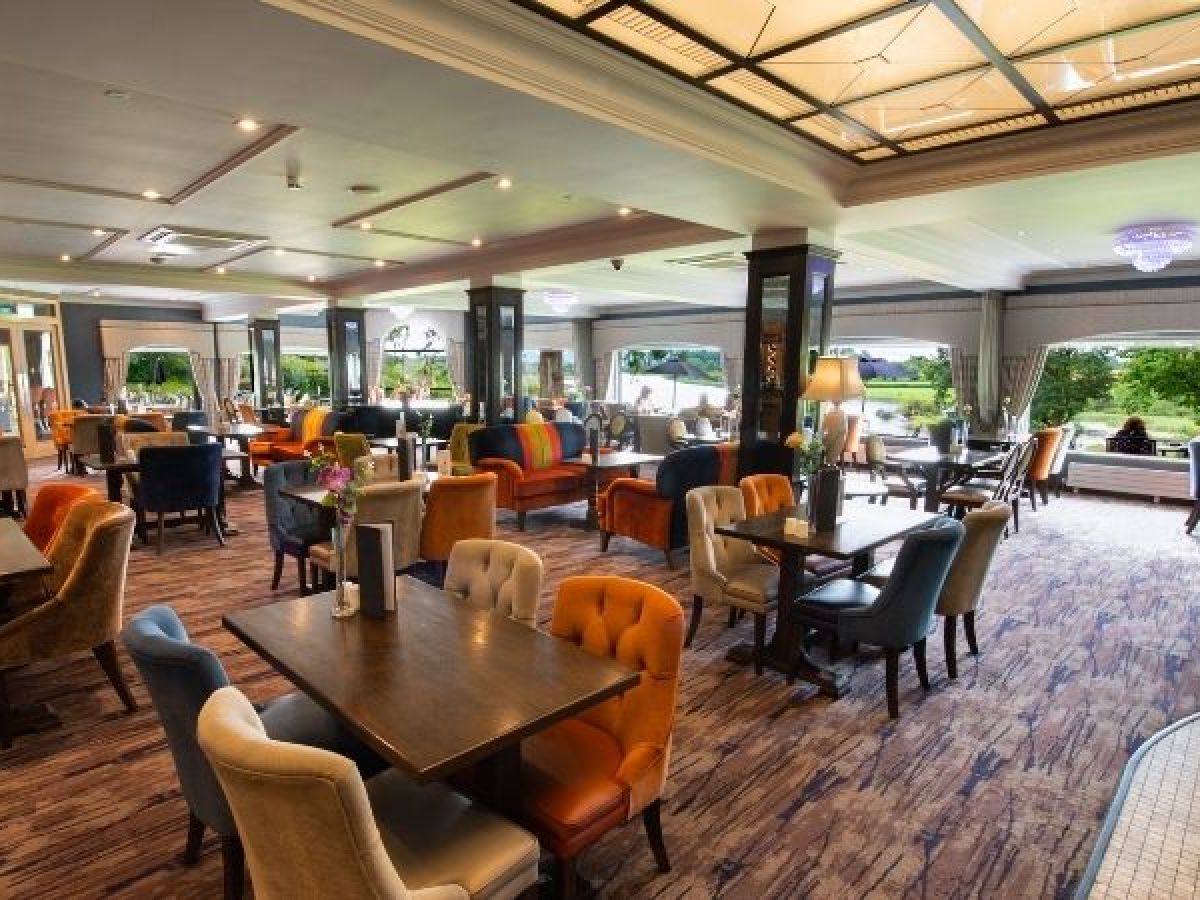 a living room filled with furniture and a large window